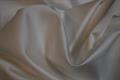 “Fed” polyester satin med stretch 330 g/m - ivory